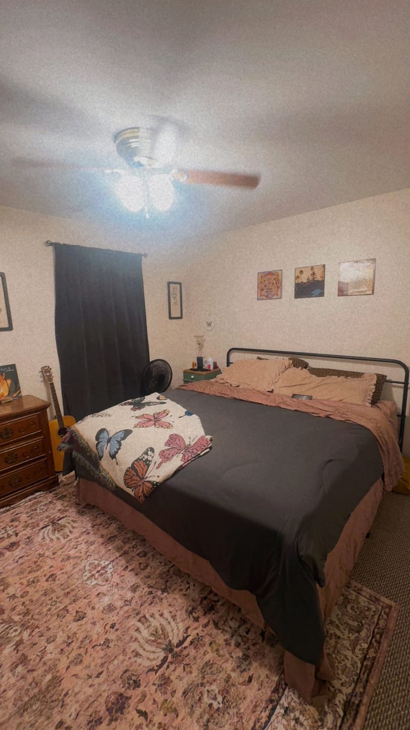 Bedroom with the BreezeComfort comforter and a folded throw